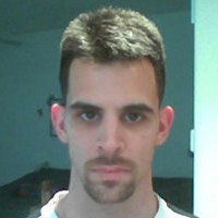 Ned Fisher Dark-haired man with a mustache and goatee